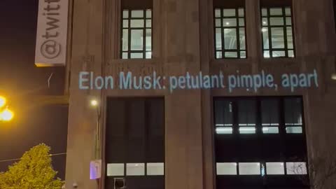 USA. Activist projects messages to Elon Musk at Twitter HQ tonight in San Francisco.