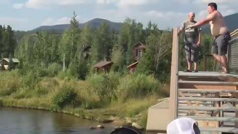 Guy Falls Face-First Into Water While Attempting to Jump Over Handrail and Dive