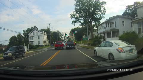 Impatient pickup trucks can't wait for road crew to move