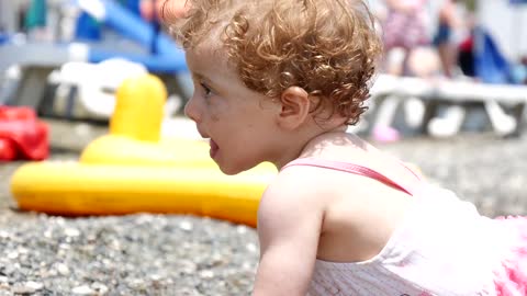 little girl playing on the beach