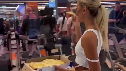 would you like to eat this ? girl outside gym, tempting with delicious food.