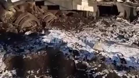 Ukrainian soldier show scattered remains of a Ukrainian armored vehicle