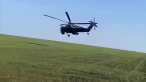 Russian soldier records himself between a KA-52 and a MI-28 flying extremely low