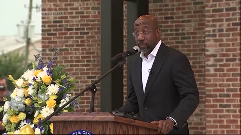 Senator Raphael Warnock speaks at Georgia vigil mourning victims of mass school shooting