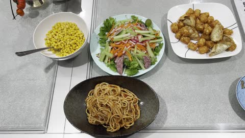 What we ate today: Spaghetti with meat sauce, tater tots, corn, and green salad.