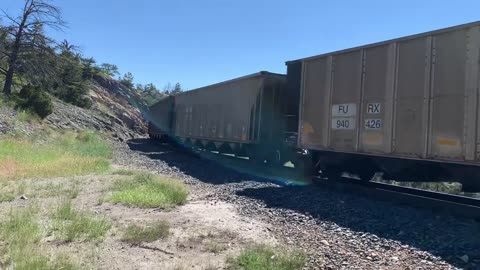 Solid EMD SD70ACe lineup up Mullan Pass. 3 BNSF, 4 MRL, then 1 BNSF on the rear.