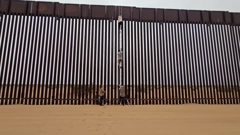 SHOCKING FOOTAGE! Watch Migrants Climb Border Wall. San Luis Arizona.