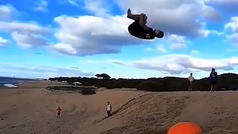 Perform a front somersault on the beach