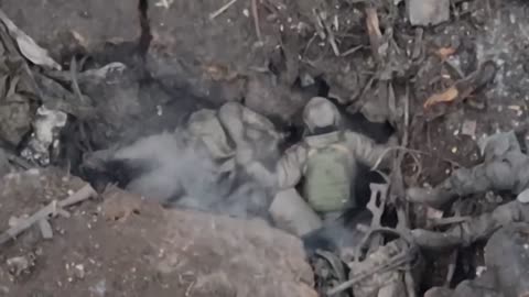 Three Russians tried to hide under a blanket but a FPV drone hit them. Graphic.