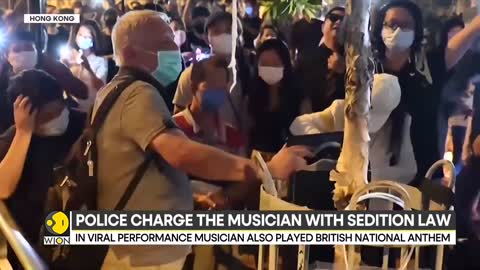 Hong Kong charges harmonica player with sedition law at Queen vigil | Latest English News | WION