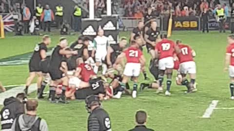 Man Streaks Across Field at Rugby Match