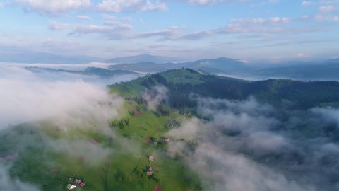 Aerial view of some clouds over a village