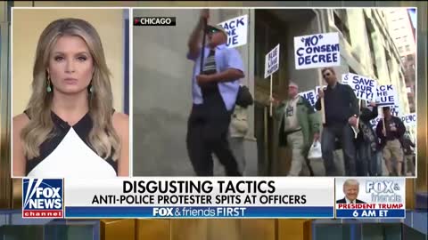 Unhinged: Anti-police protester spits at Chicago police officers