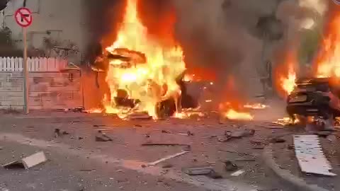 The aftermath of Hezbollah rocket strike near a building in Kiryat Bialik