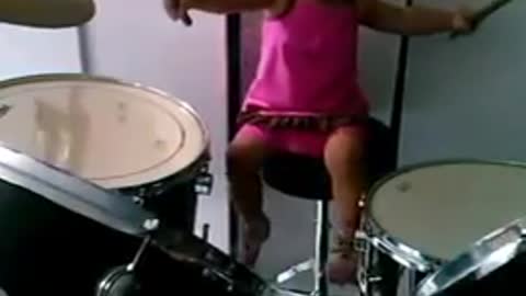 1 year old baby playing drums