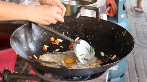 Steamed noodle in wok pan