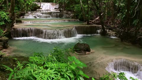 Majestic Waterfall In Tropical Forest Of Thailand