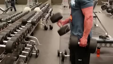 Bicep curling 80 lb dumbbells good form @ 6' 203