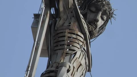 Metal sculpture of a crucified Jesus Christ