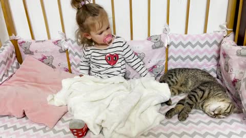 Cute_Baby_Sleeping_With_a_Cat_Sammy