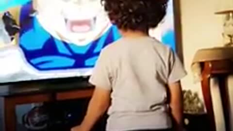 Super excited kid gets fired up for favorite cartoon