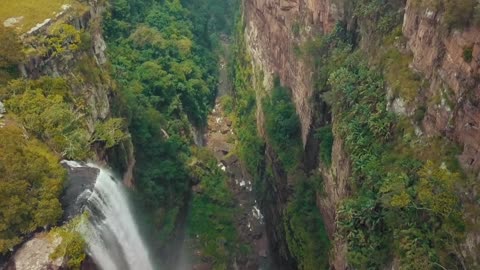 Water cascades down a rugged cliff