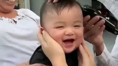 Adorable baby's haircut.......