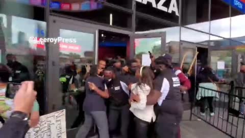 Protesters against vaccine mandates breaking through barricades to Barclay's Center in NYC