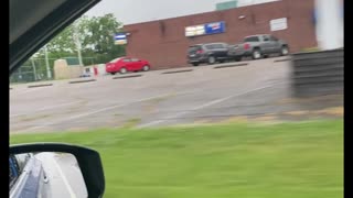 Employees Mop Up Parking Lot