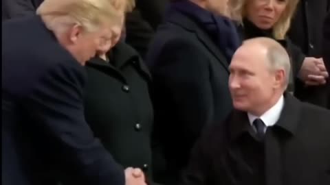 Trump and Putin shake hands