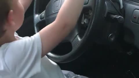 Kid Enjoys Driver's Seat