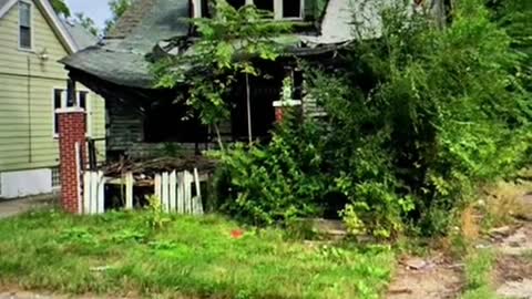 2009: A Family sits on their porch in Detroit, Michigan 3