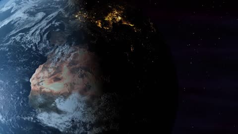 The planet earth rotates from day into night as city lights turn on (loop)