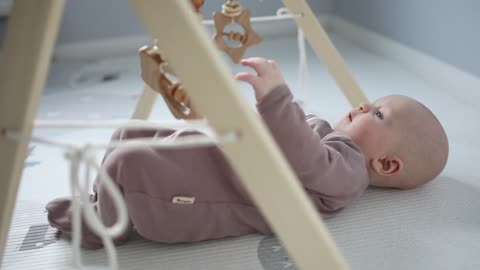 A baby playing with a toy