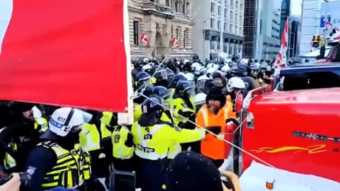 Canadian Police Push Peaceful Protester in the Snow