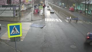 Strong Winds Send Roof into the Road