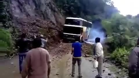 The bus falls off a cliff on the "road of death" in Bolivia.