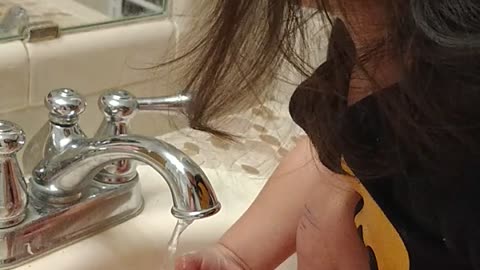 Baby washing hands