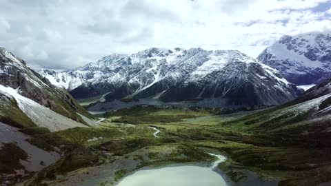 Beautiful Snowy Mountain with blue water lake and its a amazing & mind blowing view