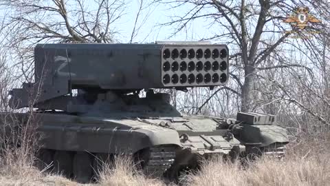 Russian TOS-1 incendiary/thermobaric multiple rocket launcher system firing