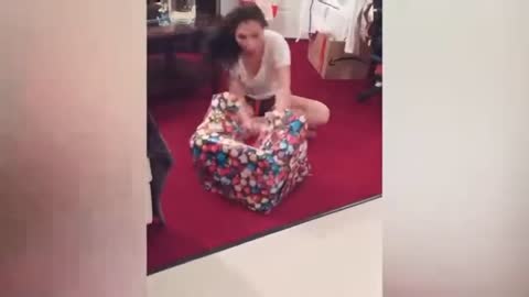 BABY FALLS INTO THHE GIFT TO OPEN IT- TRY NOT TO LAUGH