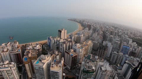 Paraglider incredibly lands right beside rooftop pool