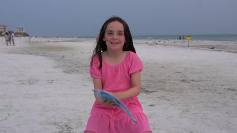 Young Lady Reads Skimmy the Black Skimmer