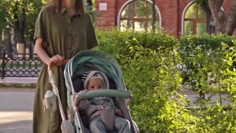 Baby with mom in garden