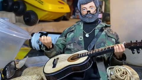 SERGEANT SOLDIER does some blues scale practice on his gee tar.