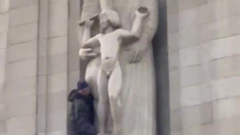 PAIR OF LADDERS AND A LUMP HAMMER, ERIC GILL STATUE PULLED DOWN