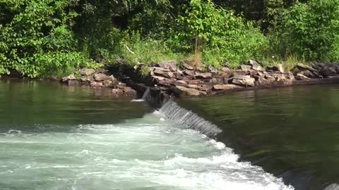 Kayaker OGLogan and associate go over an infamous water fall