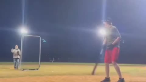 guy throws baseball from outfield and lands it on batters head.