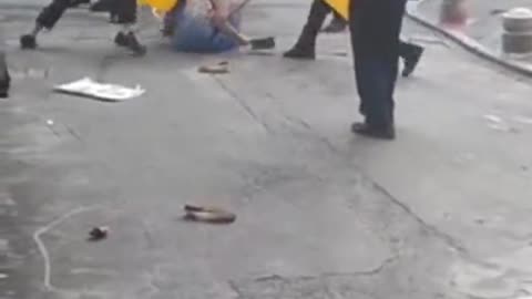 Chinese Cops Disarm Woman Wielding a Meat Cleaver