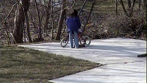 1998 Ashley and Jacqueline Riding a Bike